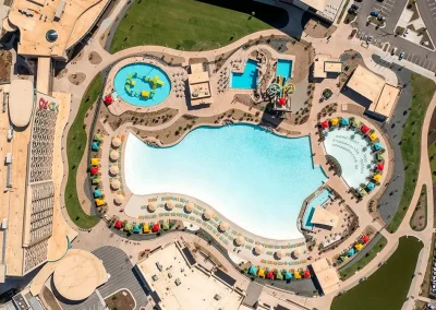 The pool at OKANA from a top-down aerial view.